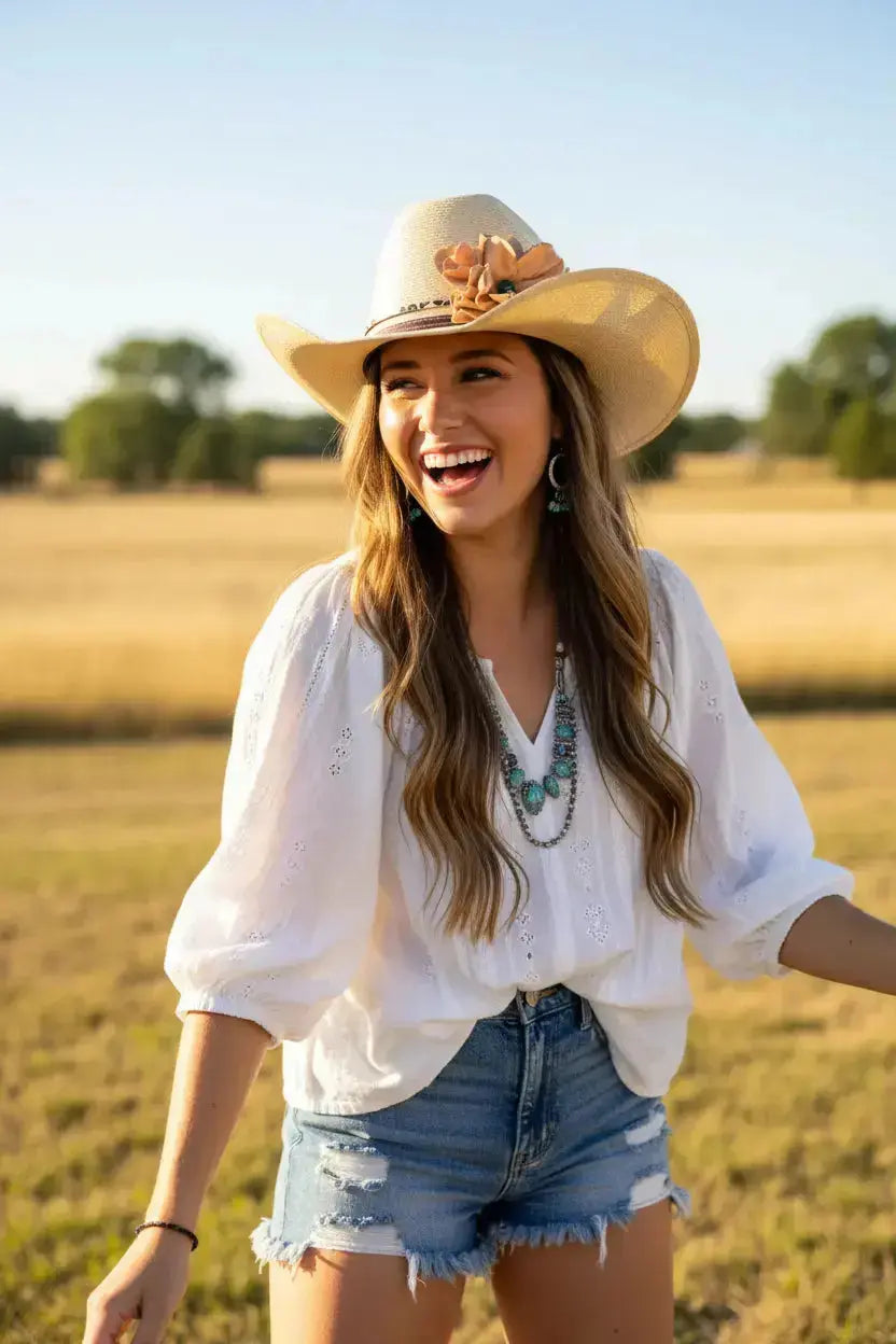 Woman wearing a cowgirl hat and having fun