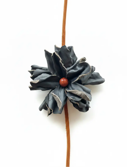 Black leather flower with Red Jasper stone hair bow and headband. Also a cowgirl hat band.