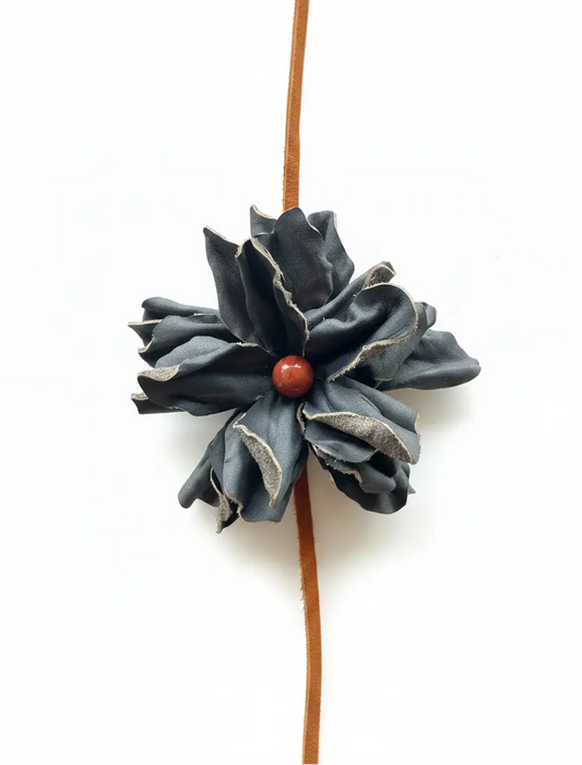 Black leather flower with Red Jasper stone hair bow and headband. Also a cowgirl hat band.