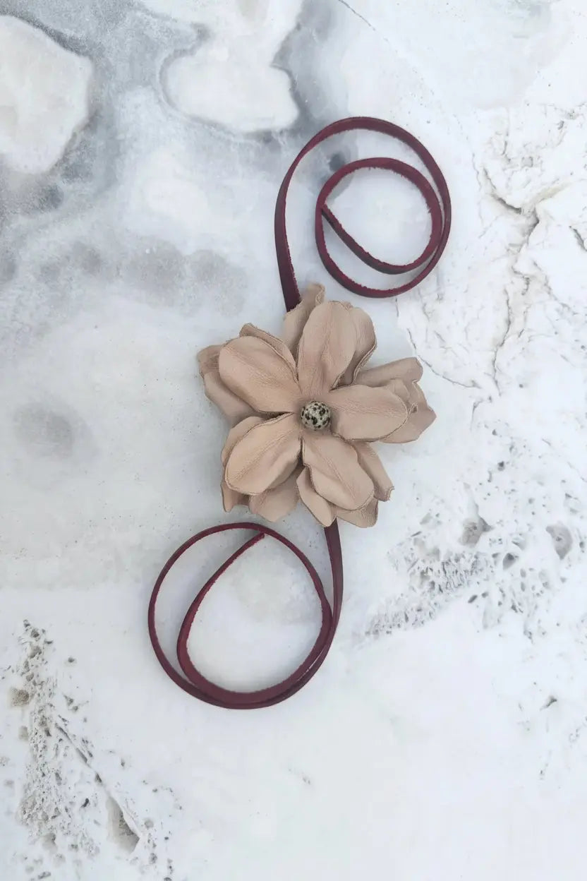 Leather Flower Hair Bow + Headband w/ Dalmatian Stone | Red Cowgirl Hat Band | Yara | Laying on a Stone Table