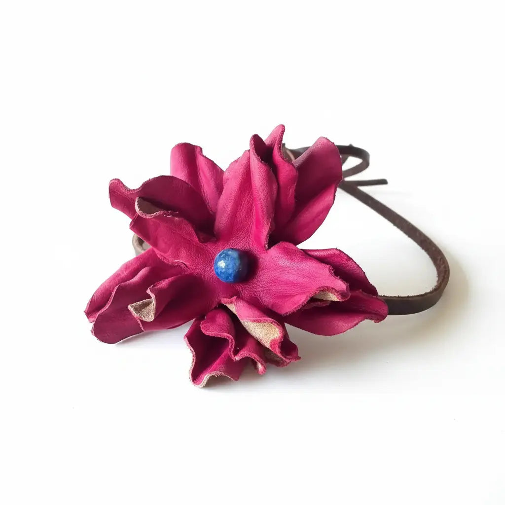 Red leather flower hair bow and headband with a blue center on a white background. Also is a beautiful cowgirl hat band.